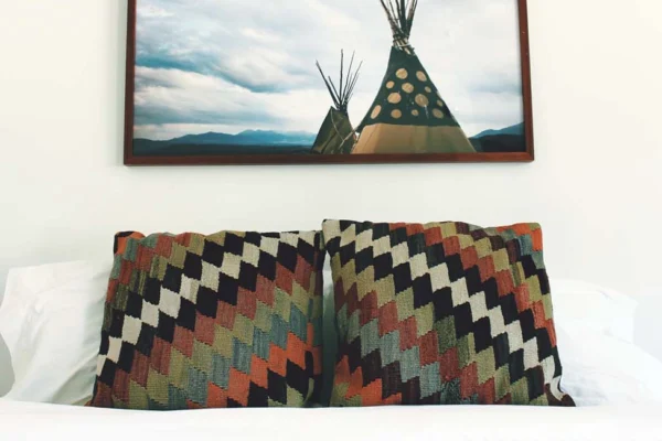 Bed with patterned pillows